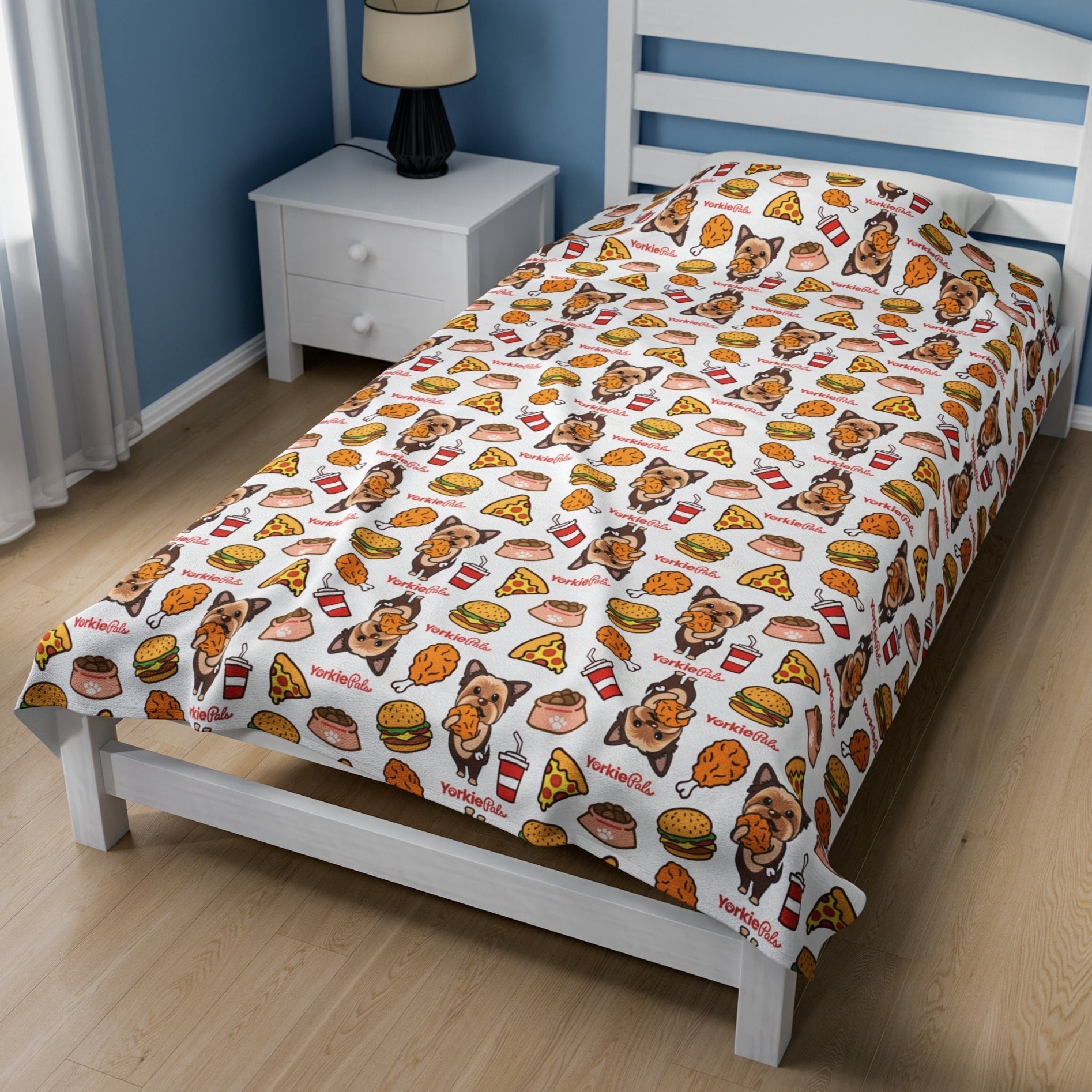 Yorkie Pals blanket decorated with playful illustrations of Yorkie dogs and colorful junk food items